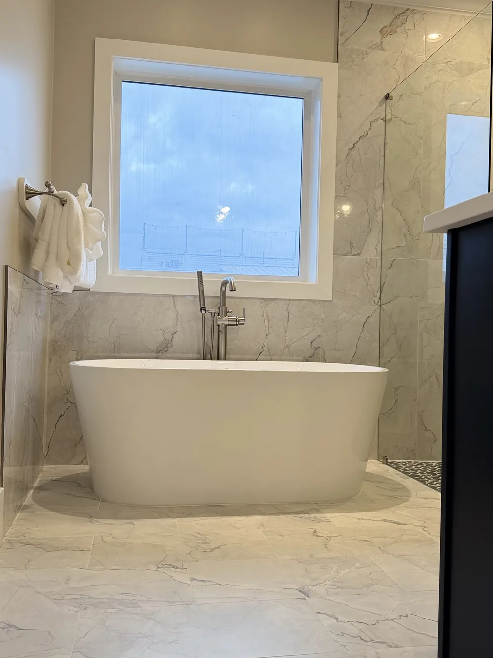 Marble bathroom with a freestanding bathtub